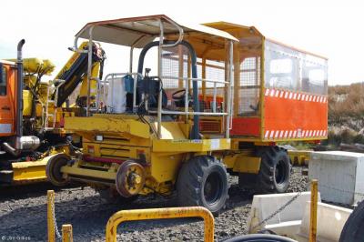 image showing a large yellow on-track machine
