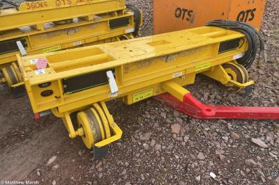 image showing a large yellow on-track machine