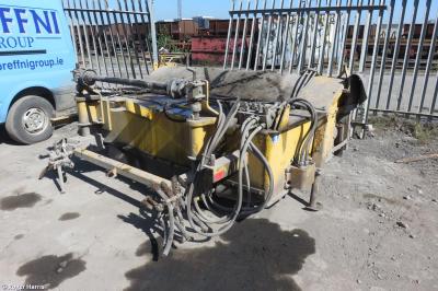 image showing a large yellow on-track machine