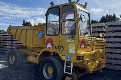 image showing a large yellow on-track machine