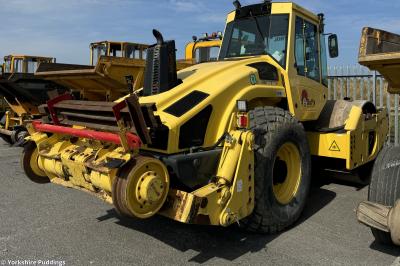image showing a large yellow on-track machine