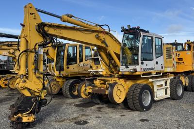 image showing a large yellow on-track machine