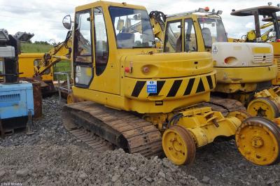 image showing a large yellow on-track machine