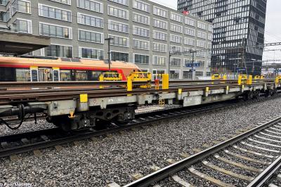 image showing a large yellow on-track machine