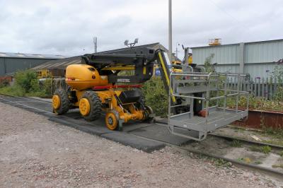 image showing a large yellow on-track machine