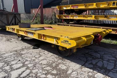 image showing a large yellow on-track machine
