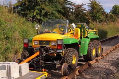 image showing a large yellow on-track machine