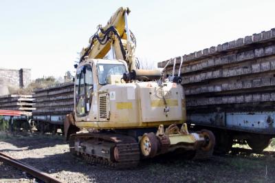 image showing a large yellow on-track machine
