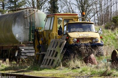 image showing a large yellow on-track machine