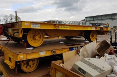image showing a large yellow on-track machine