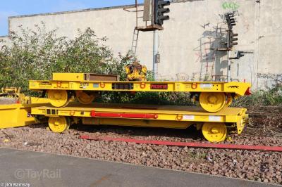 image showing a large yellow on-track machine