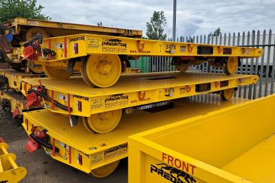 image showing a large yellow on-track machine