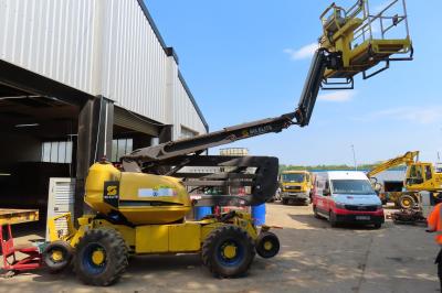 image showing a large yellow on-track machine