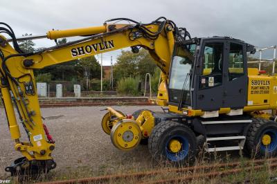 image showing a large yellow on-track machine