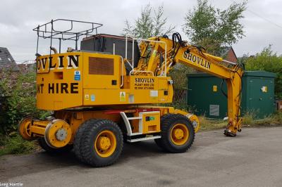 image showing a large yellow on-track machine
