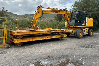 image showing a large yellow on-track machine