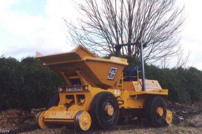 image showing a large yellow on-track machine