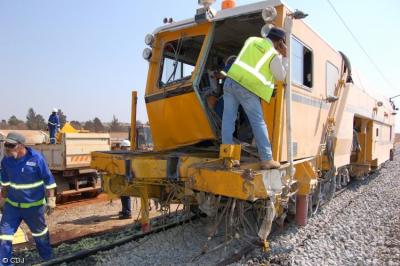image showing a large yellow on-track machine