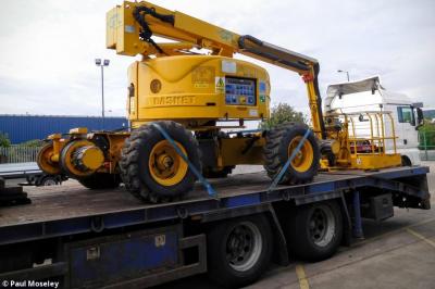 image showing a large yellow on-track machine