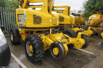 image showing a large yellow on-track machine