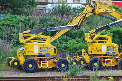 image showing a large yellow on-track machine