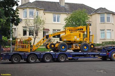 image showing a large yellow on-track machine