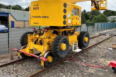 image showing a large yellow on-track machine