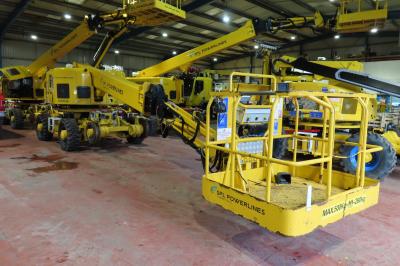 image showing a large yellow on-track machine