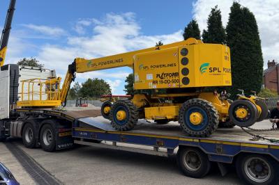 image showing a large yellow on-track machine