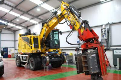 image showing a large yellow on-track machine