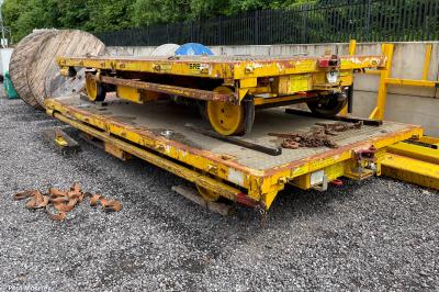 image showing a large yellow on-track machine
