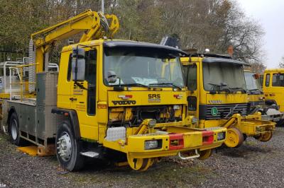 image showing a large yellow on-track machine
