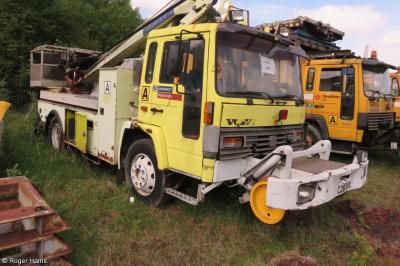 image showing a large yellow on-track machine