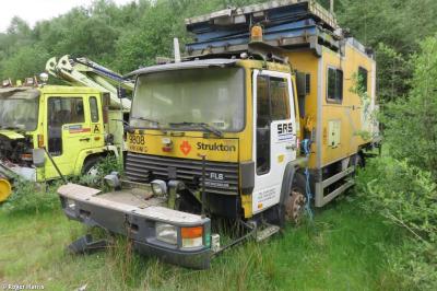 image showing a large yellow on-track machine