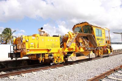image showing a large yellow on-track machine