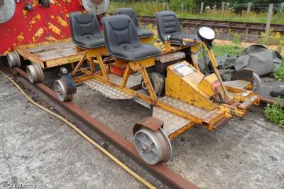 image showing a large yellow on-track machine