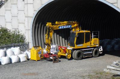 image showing a large yellow on-track machine