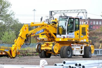 image showing a large yellow on-track machine