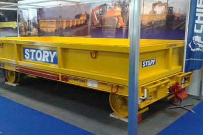 image showing a large yellow on-track machine