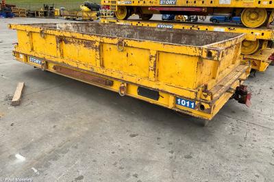 image showing a large yellow on-track machine
