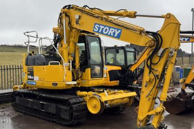 image showing a large yellow on-track machine