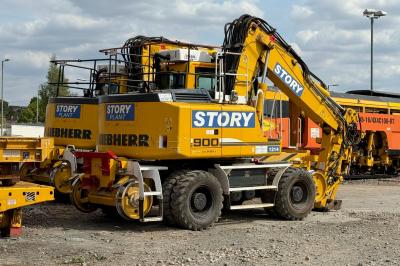 image showing a large yellow on-track machine