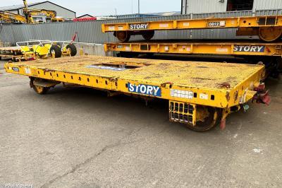 image showing a large yellow on-track machine