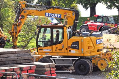 image showing a large yellow on-track machine