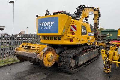 image showing a large yellow on-track machine