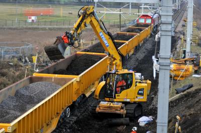 image showing a large yellow on-track machine
