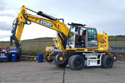 image showing a large yellow on-track machine
