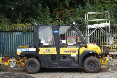 image showing a large yellow on-track machine