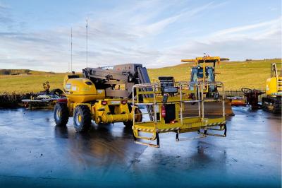 image showing a large yellow on-track machine