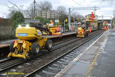 image showing a large yellow on-track machine